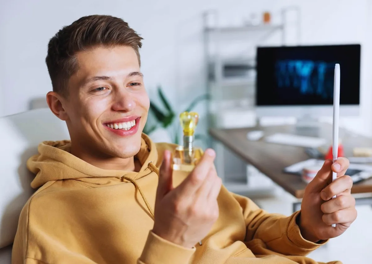 Smiling patient reviewing an affordable dental implant option during a dental consultation.