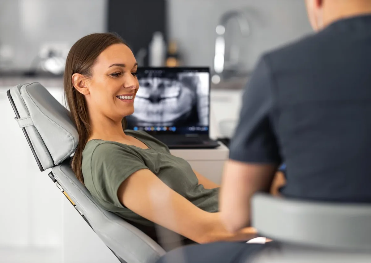 Patient discussing braces cost and orthodontic treatment options during a dental consultation.